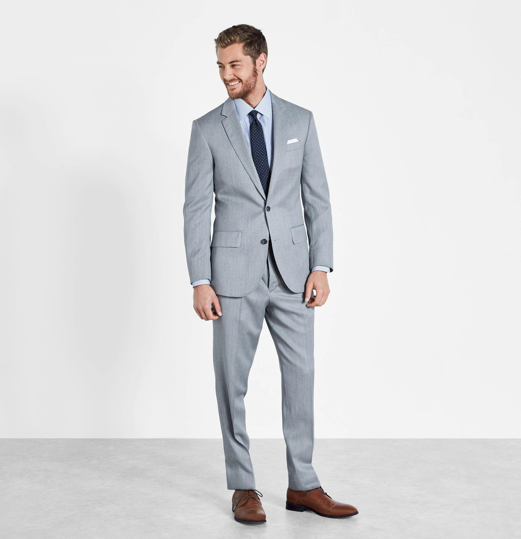 Like a cloud passing in front of the afternoon sun, this light grey suit provides the perfect shade to get you through any event in style. Includes jacket and pants. Pants are available in classic and slim fits.