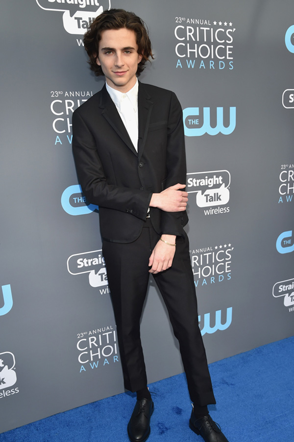 Timothée Chalamet in a grosgrain bound prom tuxedo.