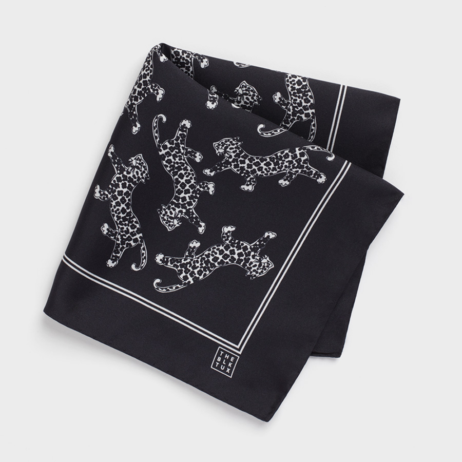 Silk pocket square by The Black Tux, with a leopard motif.