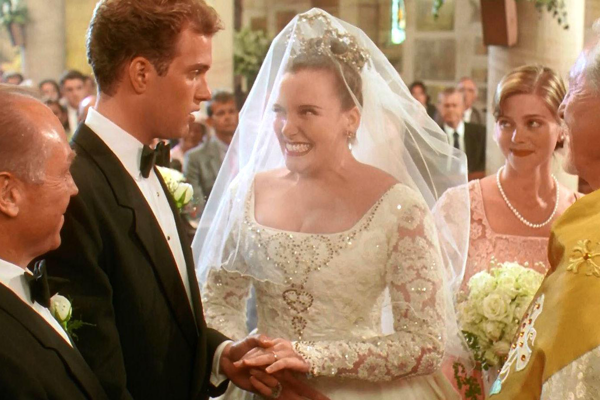 Toni Collette in bridal gown for Muriel's Wedding.