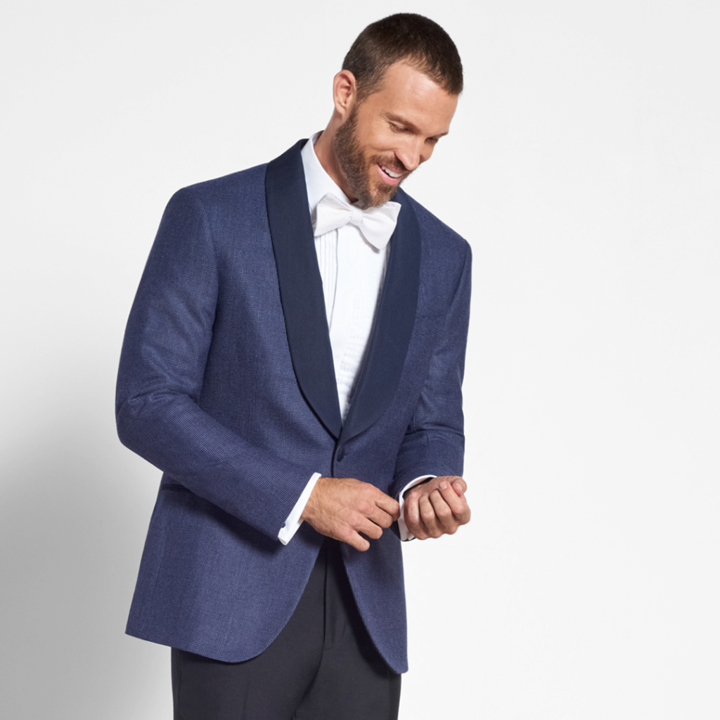 Groom in Blue wedding tuxedo jacket.