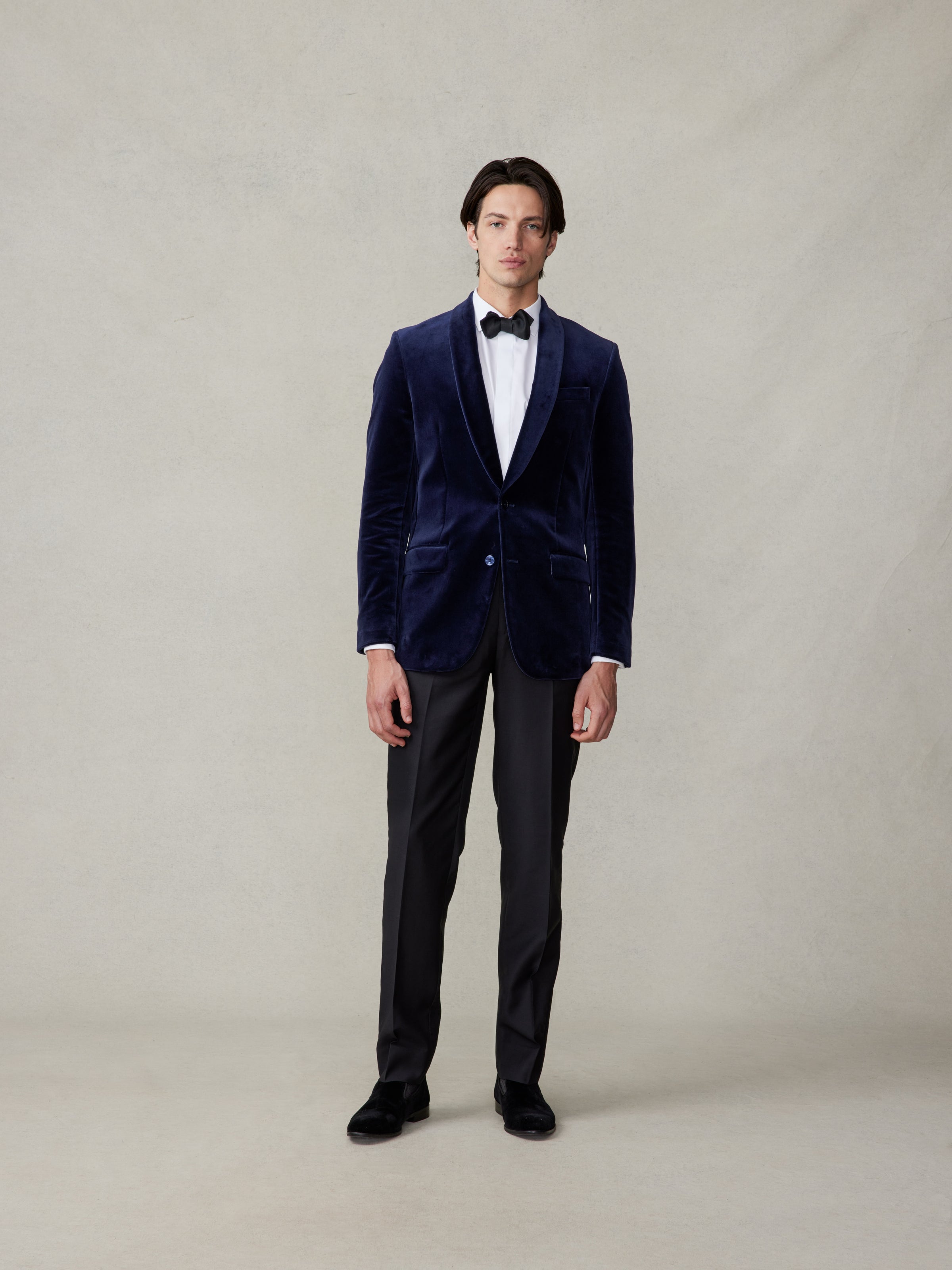 Man in an ocean blue velvet tuxedo full length