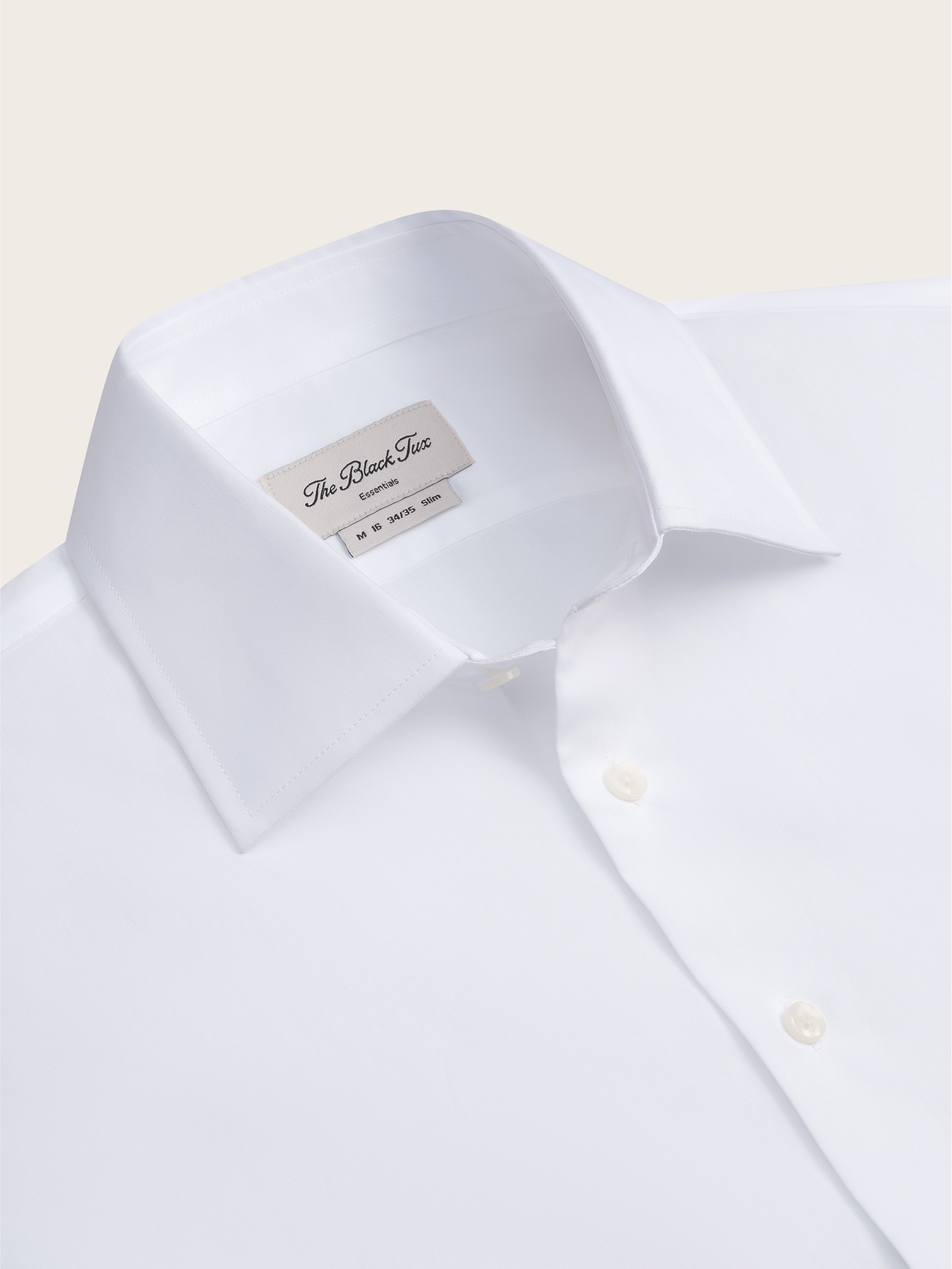 White dress shirt with a collar and buttons, labeled 'The Black Tux'.