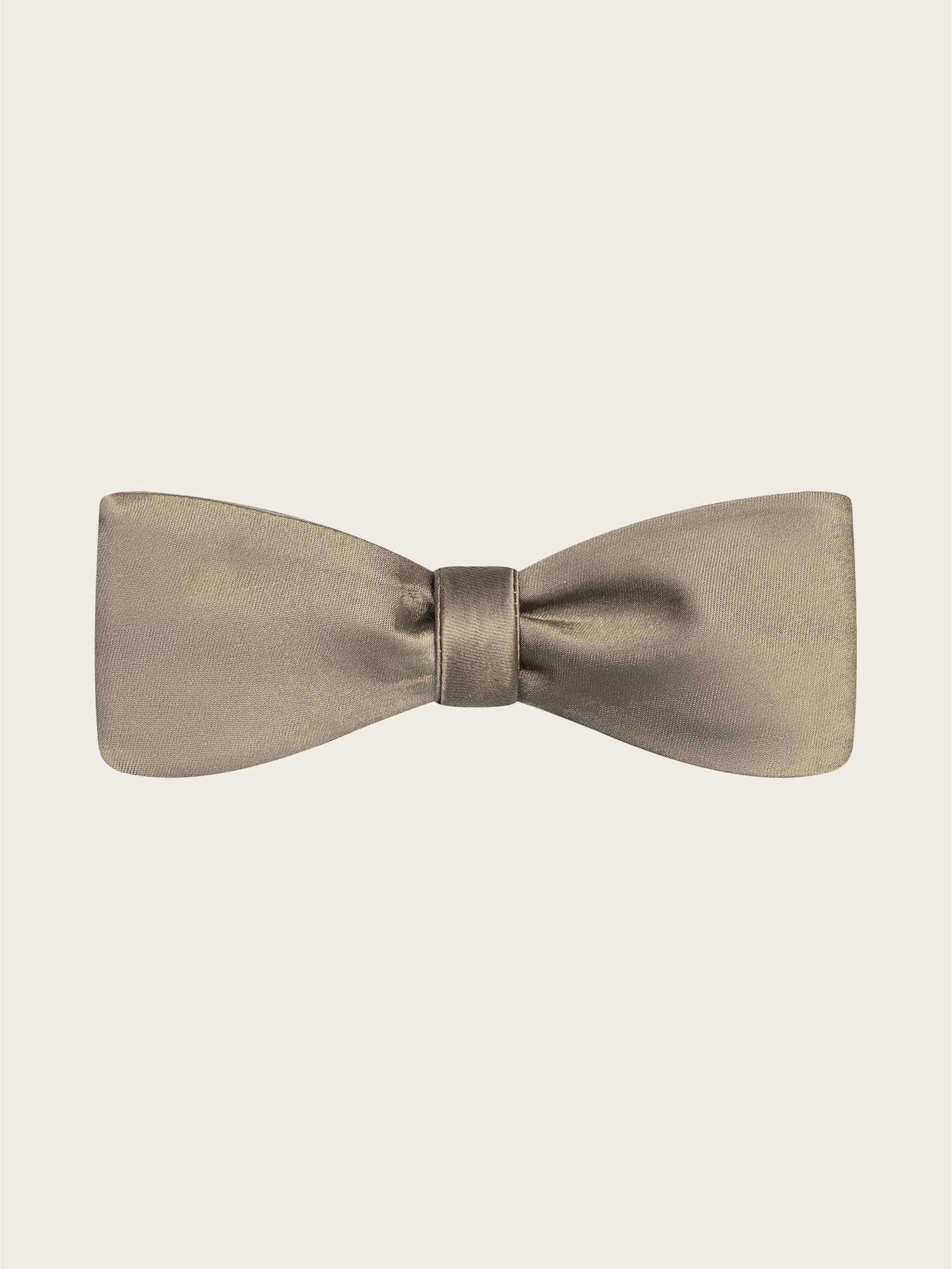 A light taupe bow tie on a plain background.