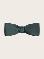 A pre-tied juniper green satin bow tie against a light neutral background