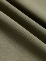 Close-up of olive green pique polo fabric texture, diagonal folds