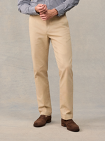 Cropped front view of khaki chino trousers with brown suede loafers