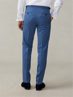 Back view of a man wearing blue formal trousers and black shoes.