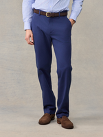 Close-up of man in navy chino pants with brown belt, light blue striped shirt, front view