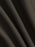 Close-up of dark fabric with visible texture and folds.