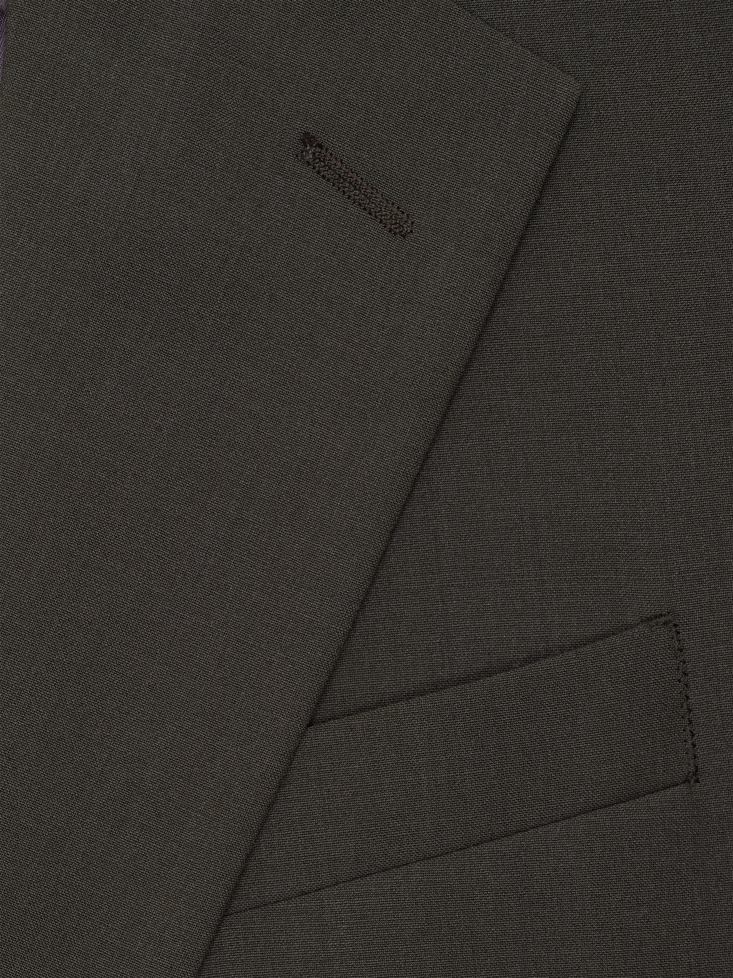 A close-up of a olive green fabric, featuring a suit lapel with a pocket detail.