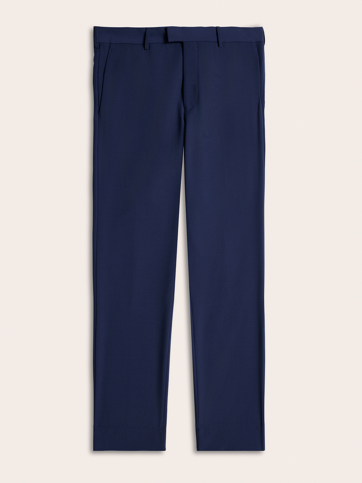 Cove blue suit pants laid flat, front view, on a cream background.