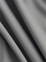 Close-up of folded grey fabric with a smooth texture.