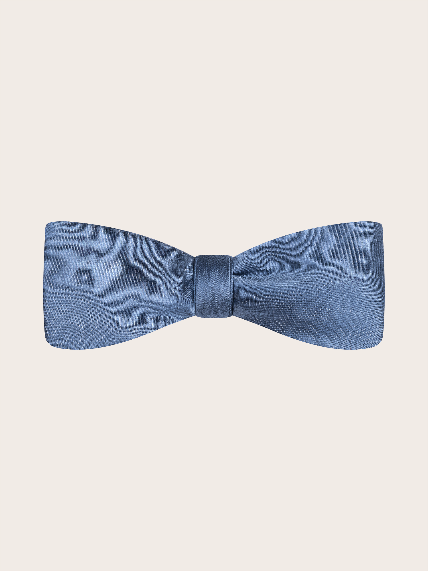 A pre-tied steel blue satin bow tie against a light neutral background