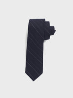 Navy tie with light blue stripes, neatly rolled.