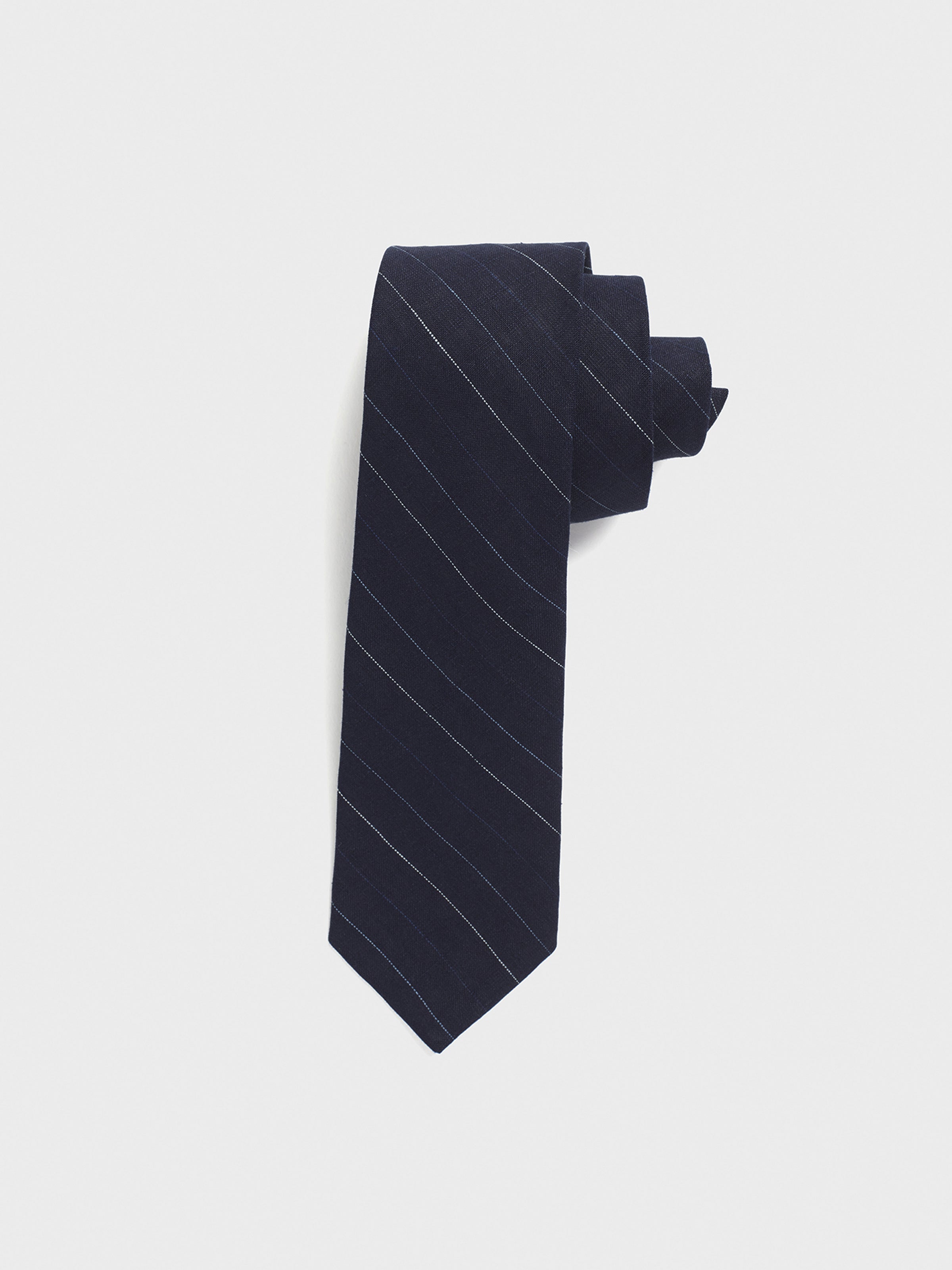Navy tie with light blue stripes, neatly rolled.