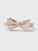 Beige satin bow tie with a knot in the center.