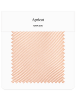 Apricot colored silk fabric swatch with a striped pattern.