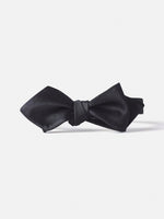 Black satin bow tie with a knot in the center.