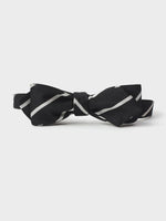 Black bow tie with white diagonal stripes.