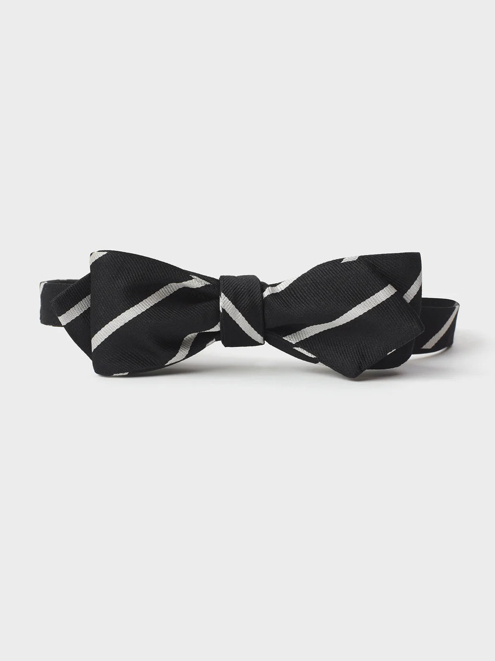Black bow tie with white diagonal stripes.