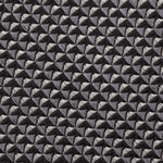 Close-up of a textured fabric with a geometric pattern in shades of gray and black.