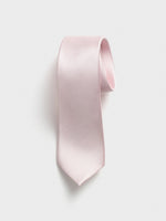 Light pink tie with a textured pattern, hanging against a white background.