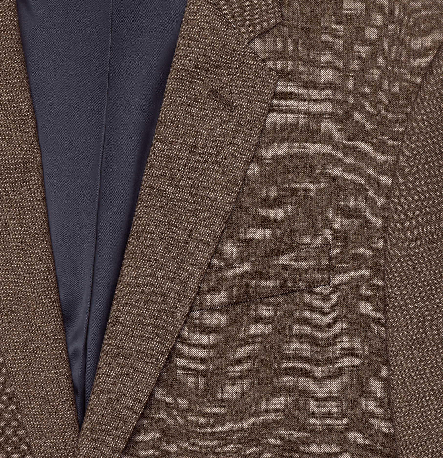 Close-up of a brown suit jacket with a gray lining and a pocket.