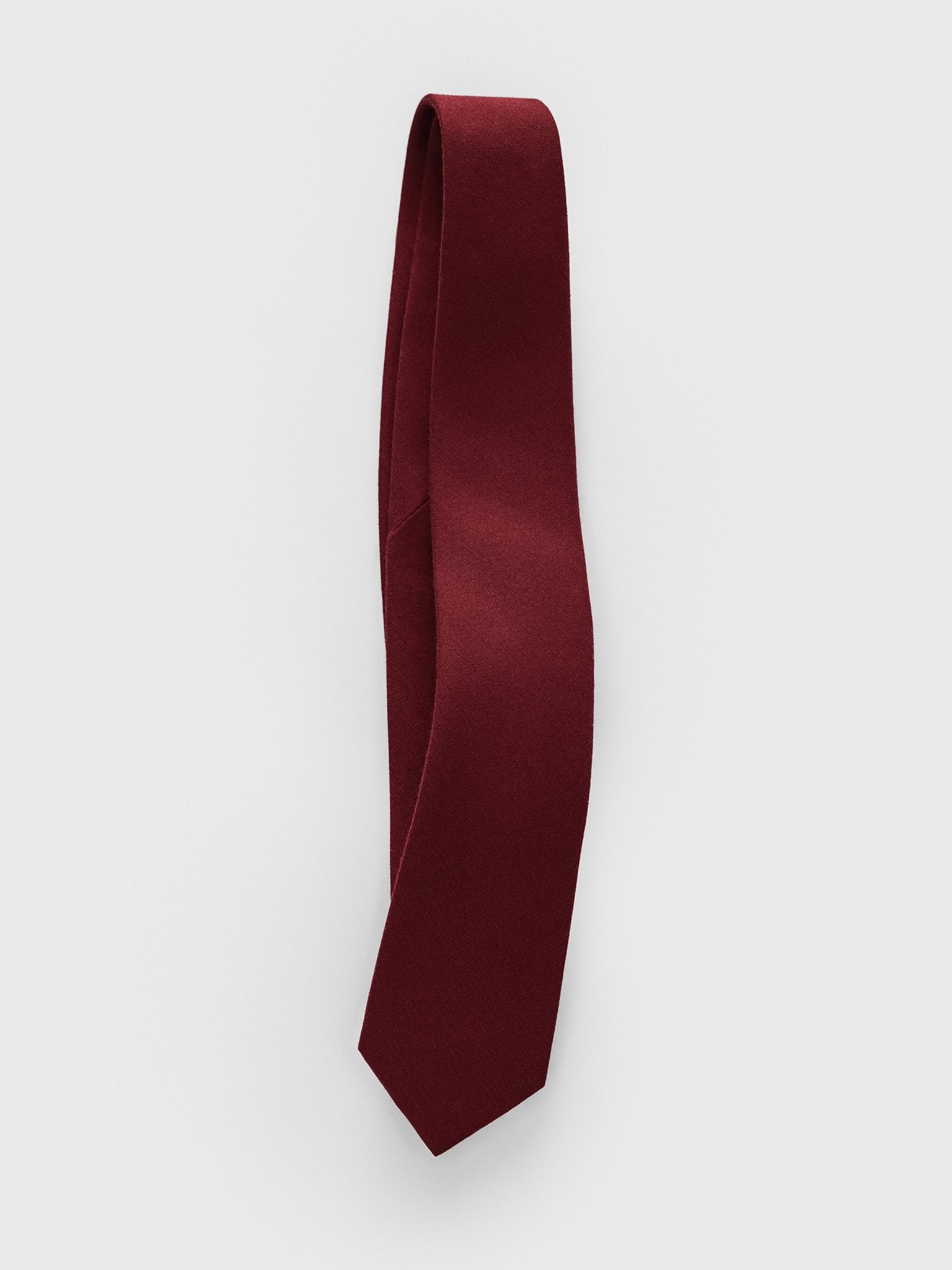 Burgundy tie displayed against a plain white background.