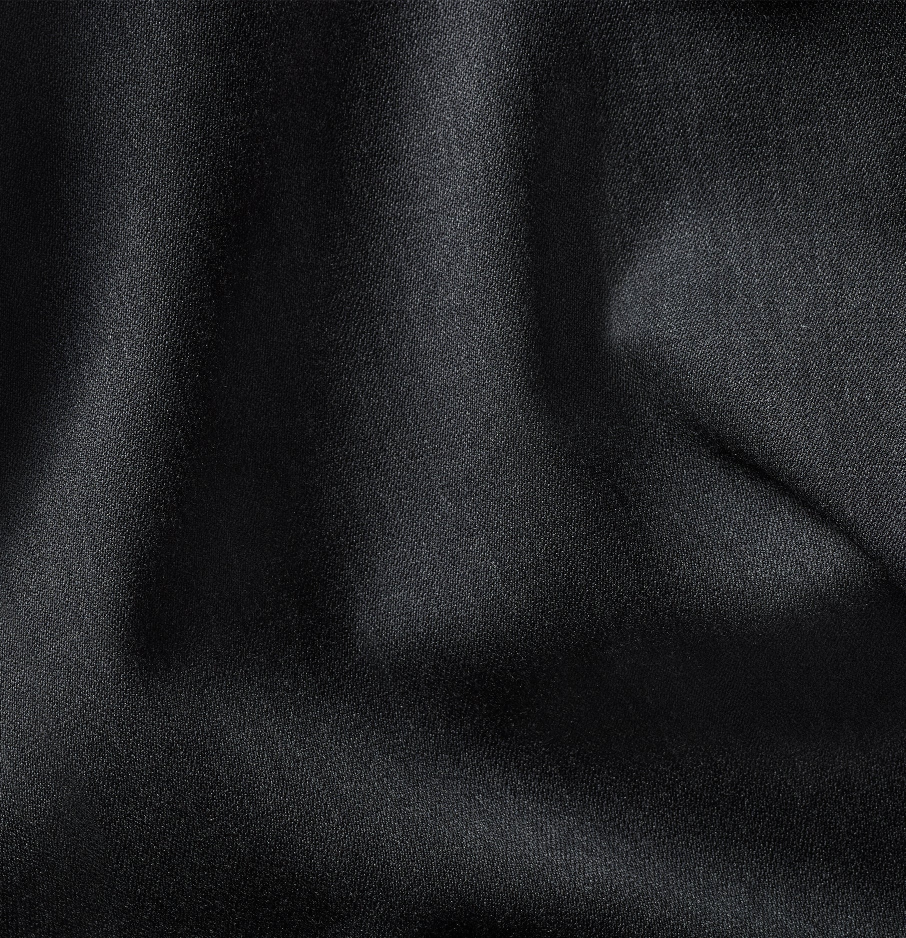 Close-up of black fabric with a smooth texture.