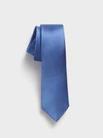 Solid blue tie with a textured pattern, draped elegantly.