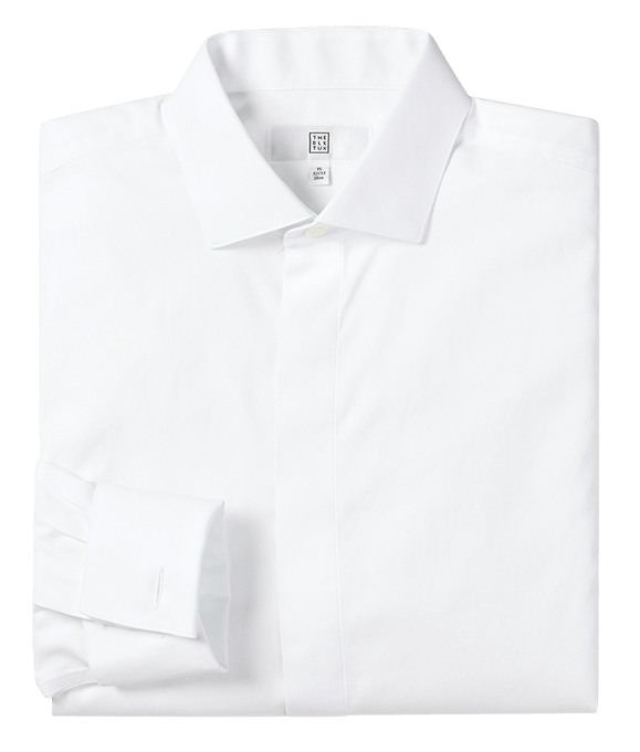 Folded white dress shirt with a buttoned collar and cuff.