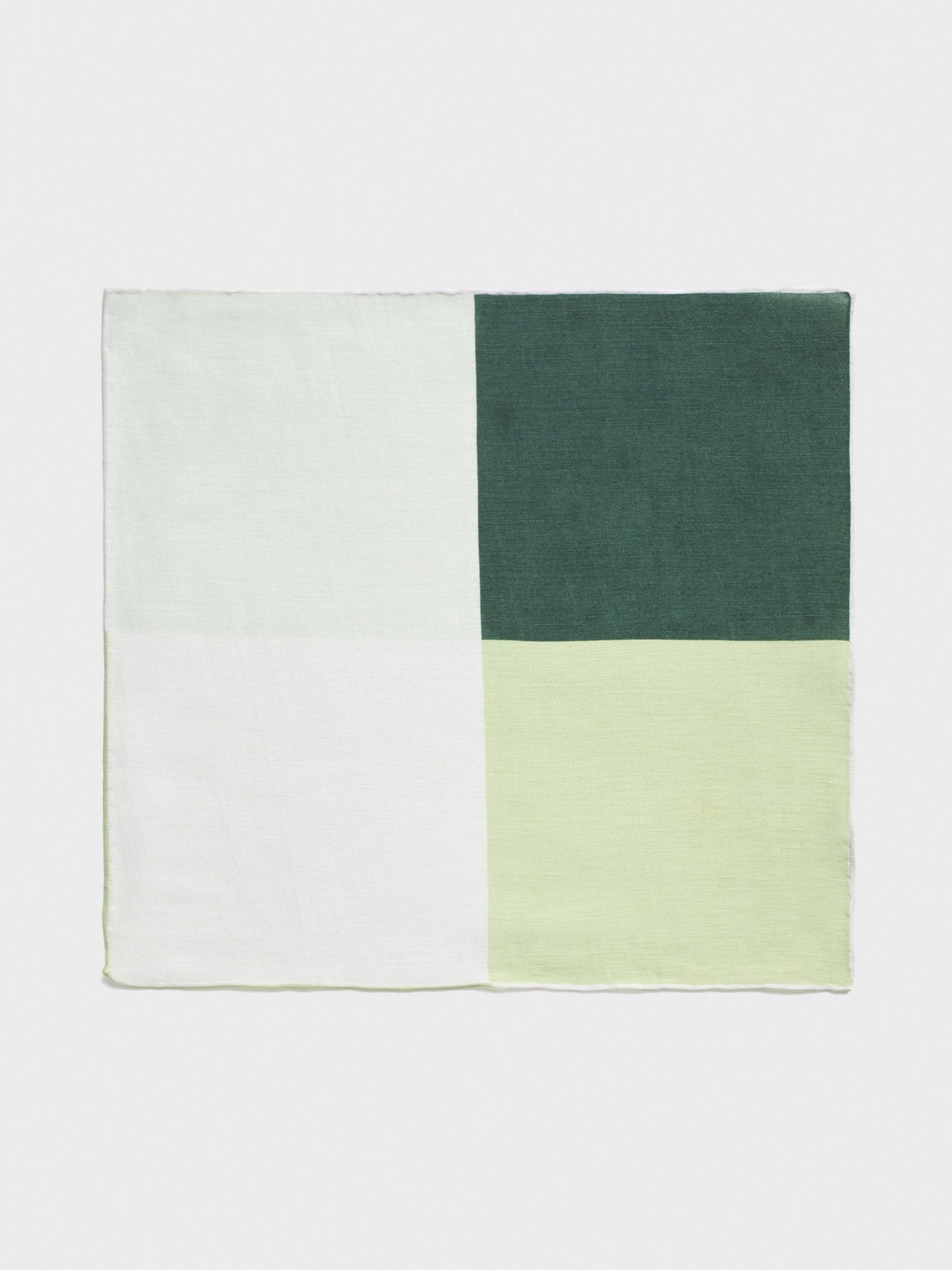 A rectangular fabric with four color blocks: white, light green, dark green, and light green.