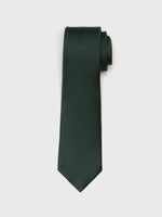 Dark green tie with a textured pattern, rolled at one end.