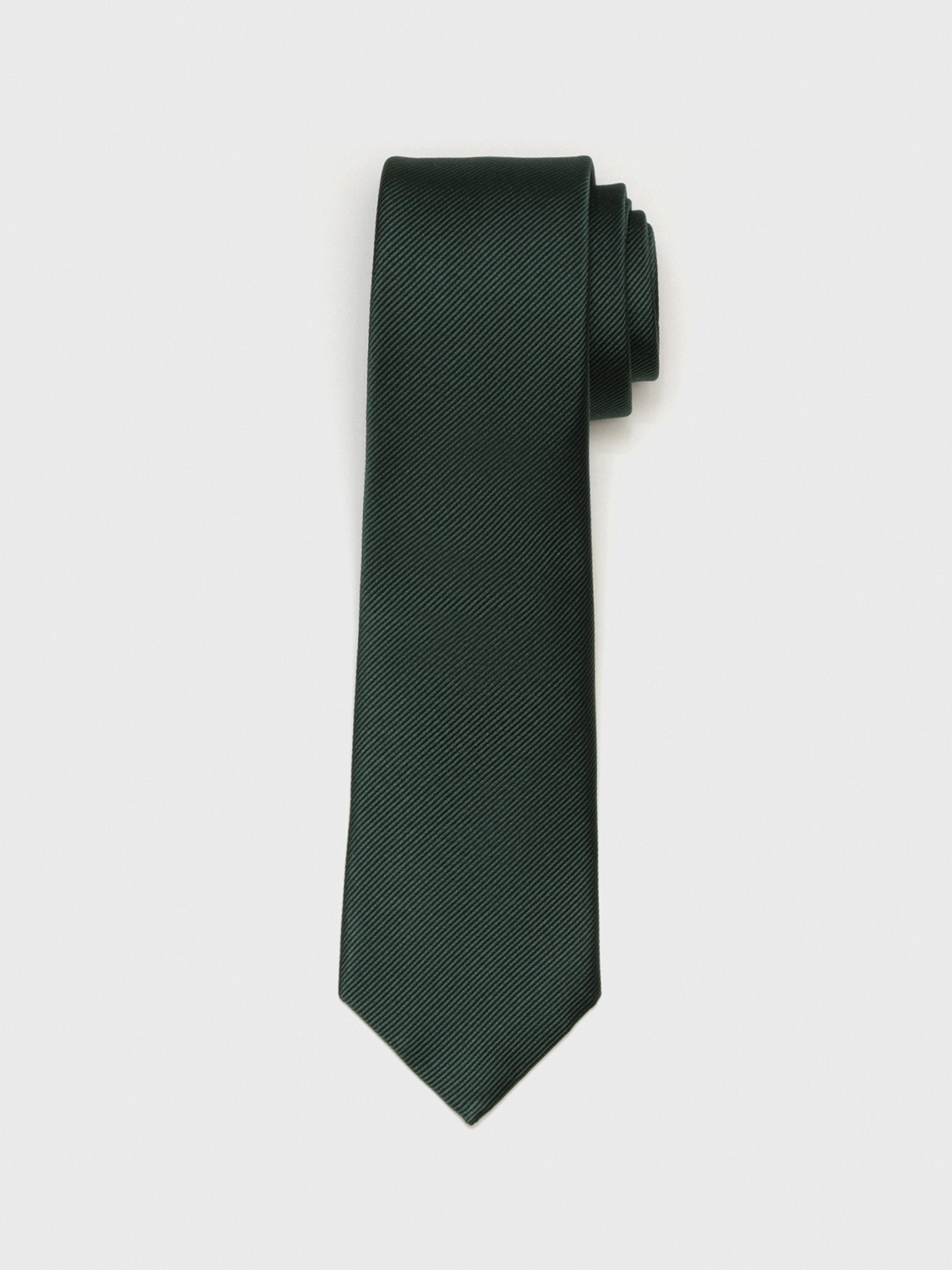 Dark green tie with a textured pattern, rolled at one end.