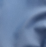 Close-up of textured blue fabric with a smooth finish.