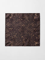 Leopard print fabric with brown and black patterns.