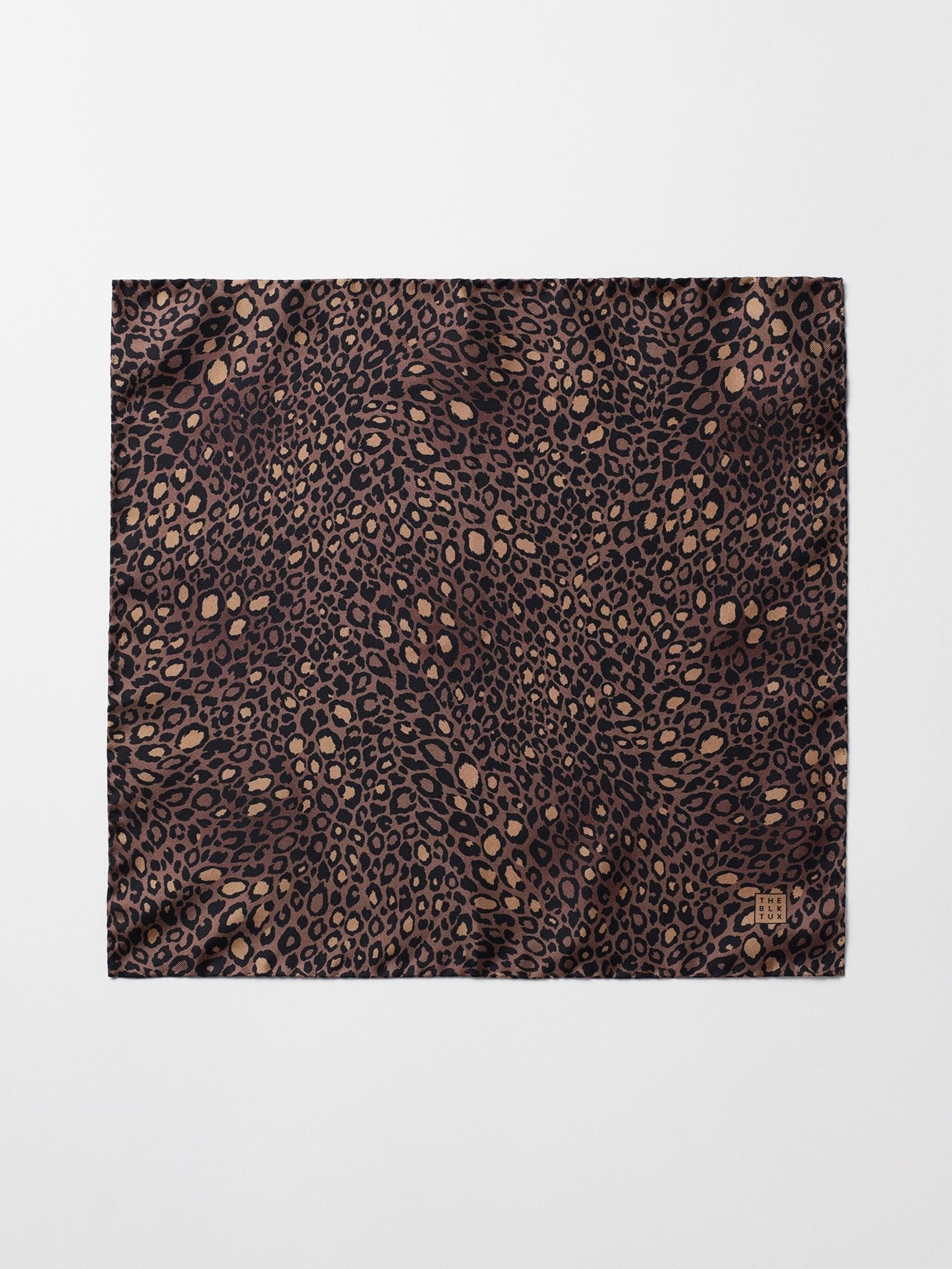 Leopard print fabric with brown and black patterns.