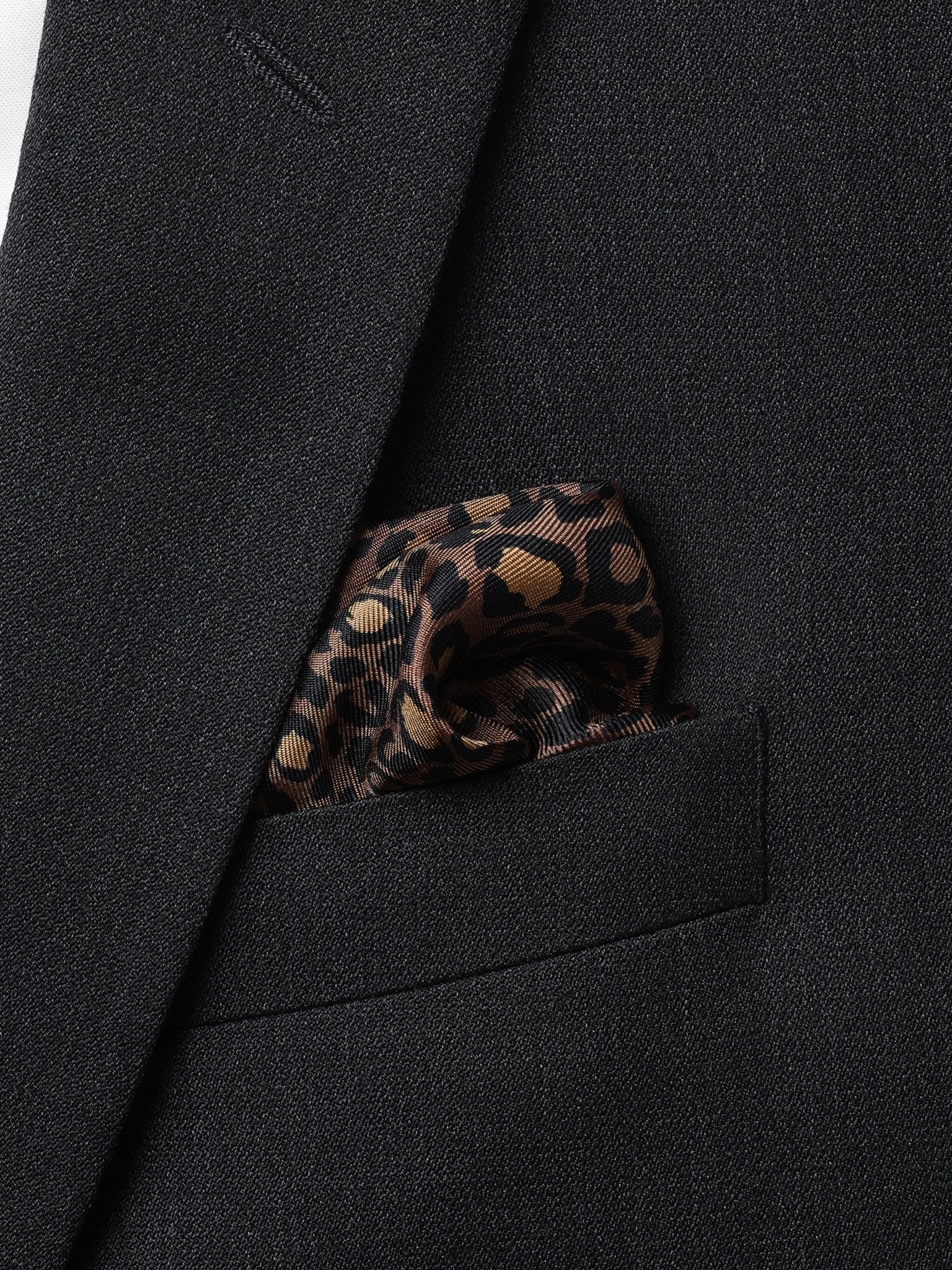 Black tuxedo jacket with a leopard print pocket square.