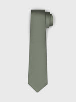 A rolled green tie with a textured pattern.