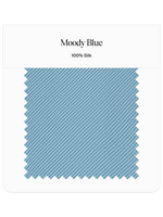 Fabric swatch labeled 'Moody Blue', 100% silk, with a diagonal striped pattern.
