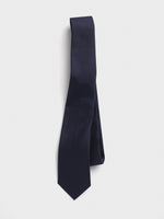 Navy tie with a textured pattern, hanging against a white background.