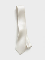 A white tie with a ribbed texture displayed against a light background.
