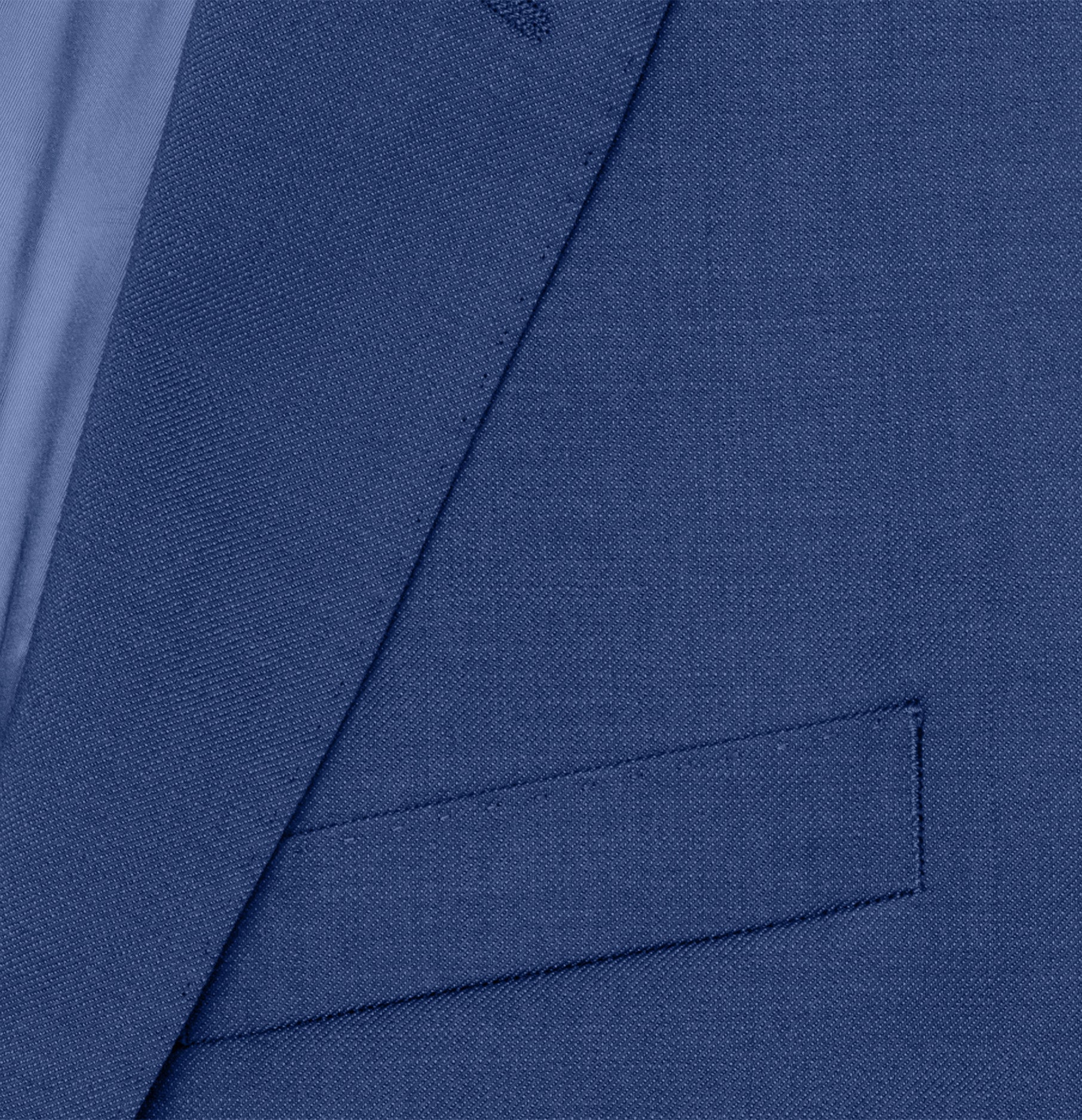 Close-up of a blue suit jacket with a pocket and lapel visible.