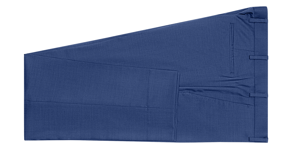 Navy blue dress pants laid flat on a green background.