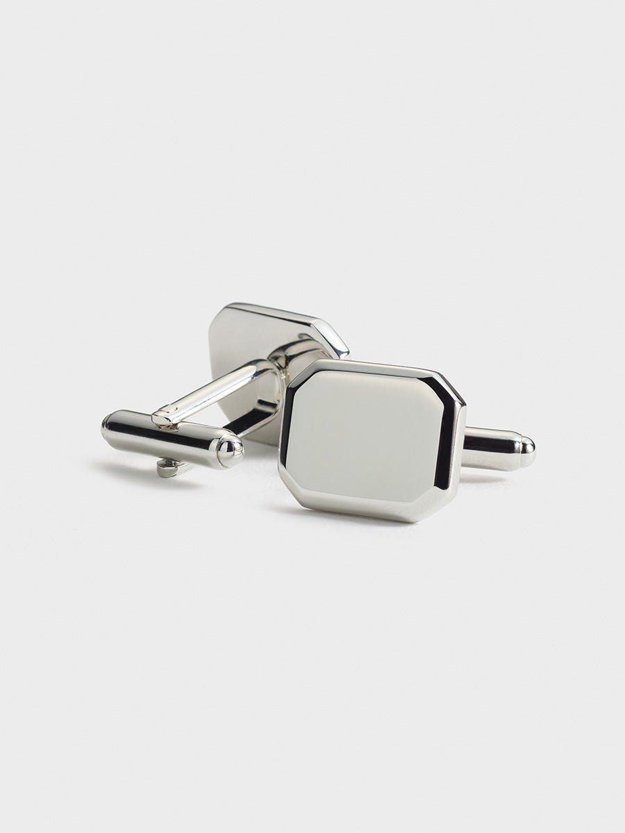 Silver octagonal cufflinks with a polished finish.
