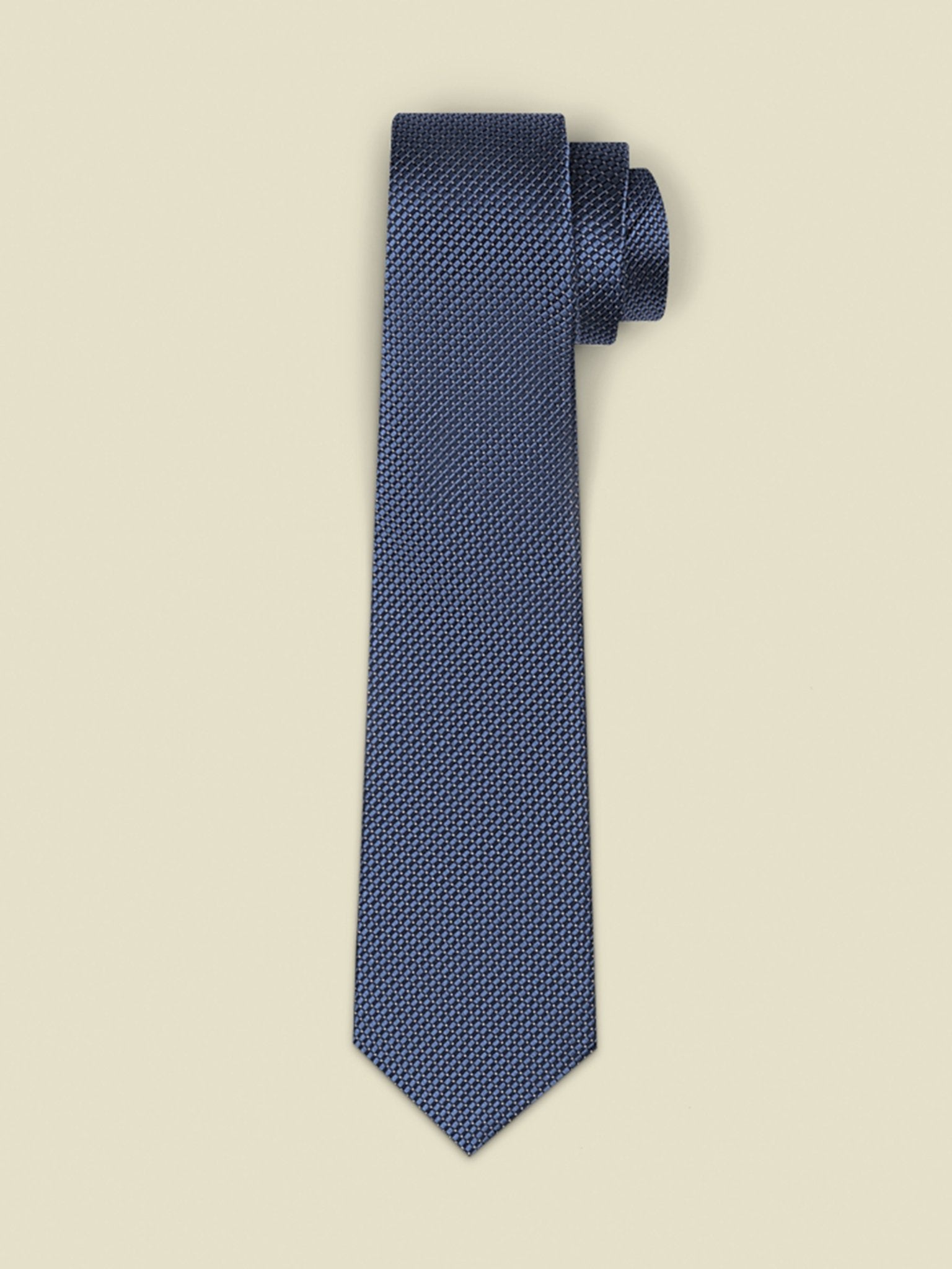 Navy blue textured tie displayed against a light background.