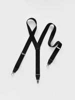 Black suspenders with clips on a white background.