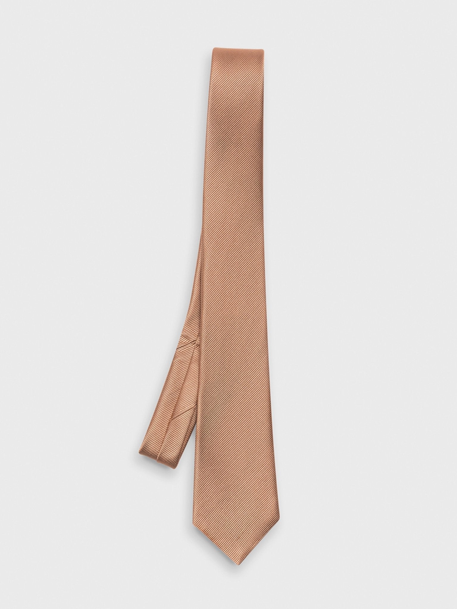 Light brown tie with a textured pattern, hanging against a white background.