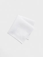 White handkerchief folded on a light background.